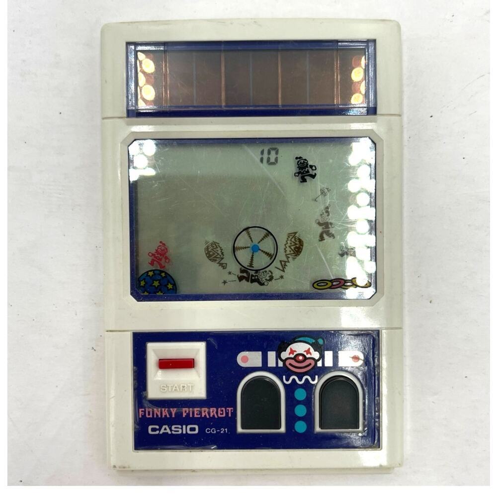 Vintage Casio CG-21 Funky Pierrot Handheld Electronic LCD Game 1982 Solar Power